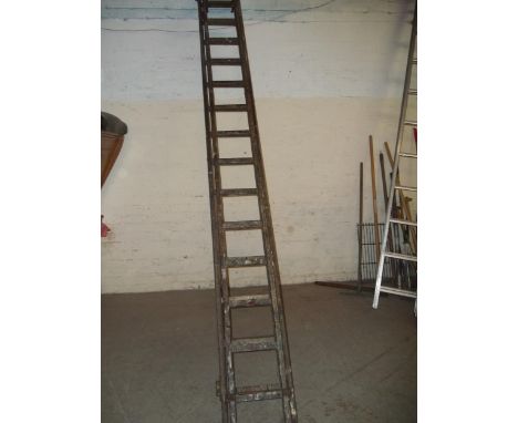 A VINTAGE WOODEN LADDER