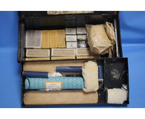 A BLACK TIN FIRST AID BOX WITH GEORGE VI SYMBOL