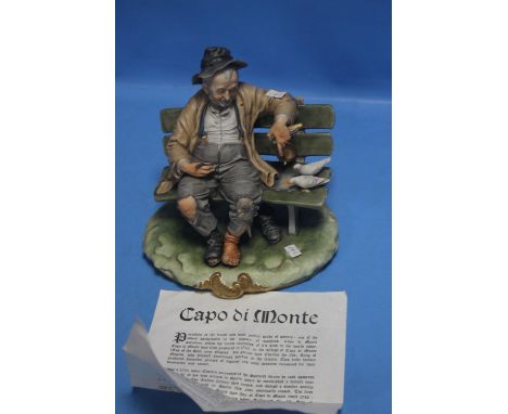 A CAPO DE MONTE FIGURE OF MAN ON BENCH