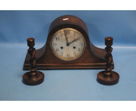 A NAPOLEON HAT MANTEL CLOCK WITH KEY AND PENDULUM TOGETHER WITH A PAIR OF SMALL BARLEY TWIST CANDLESTICKS