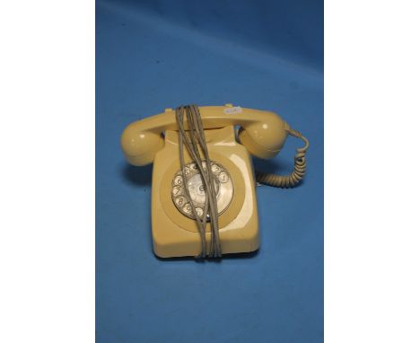 A VINTAGE CREAM DIAL TELEPHONE CONVERTED FOR USE ON A MODERN NETWORK