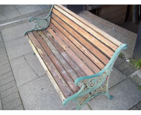 A CAST IRON AND WOOD GARDEN BENCH