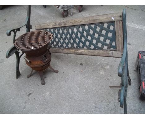 A GARDEN CAST AND WOOD BENCH AND A CAST BBQ A/F