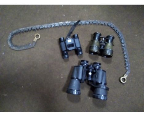 A SET OF CASED VISTA 10 X 50 BINOCULARS, LEATHER CASED PAIR OF SMALL BINOCULARS, A VINTAGE TOOL IN LEATHER CASE AND A PAIR OF