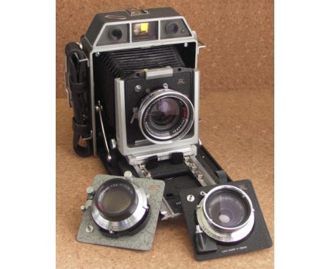 Horseman press camera, cased with three lenses, glass and film backs and film holders    CONDITION REPORT:  Camera body shows