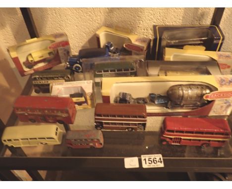 Shelf of diecast metal model vehicles including original Dinky buses