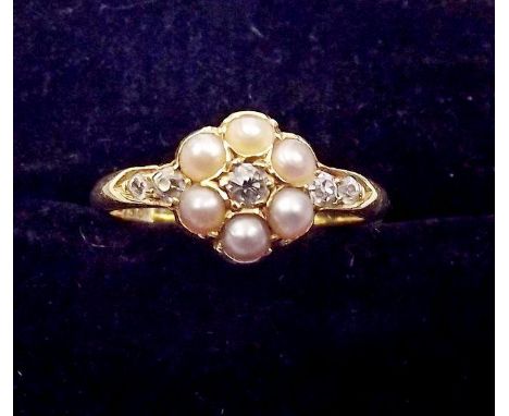 An 18ct gold Edwardian diamond and pearl floral cluster ring 