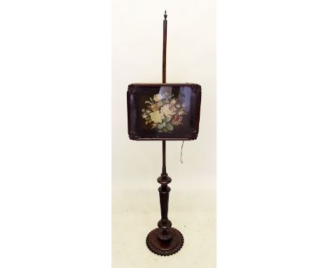 A Victorian mahogany pole screen with floral tapestry panel