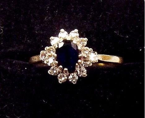 A 9ct gold sapphire and diamond cluster ring 