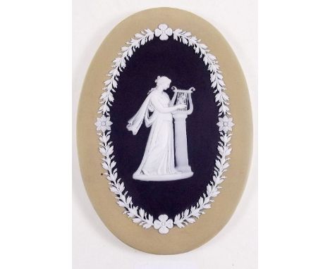 A 1930's oval Wedgwood Jasperware plaque decorated woman playing harp - 15 x 11cm