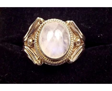 A silver and rainbow moonstone ring 