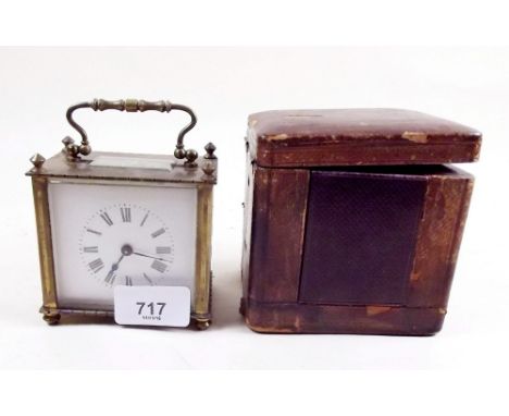 A small early 20th century French brass cased carriage clock with leather clad case and key - 8cm x 9cm x 5.5cm