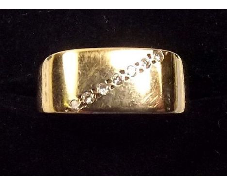 A 9ct gold gents ring set line of diamonds 