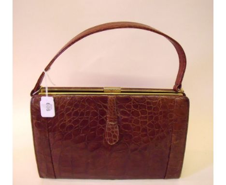 A vintage crocodile skin handbag 