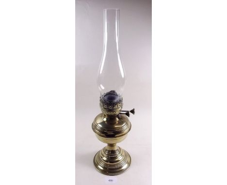A brass oil lamp with chimney