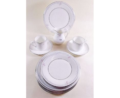 A Royal Doulton 'Carnation' part dinner and coffee service comprising: six dinner plates, six side plates, four tea plates, t