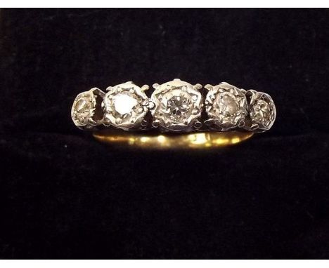 An 18ct gold five stone illusion set diamond ring 