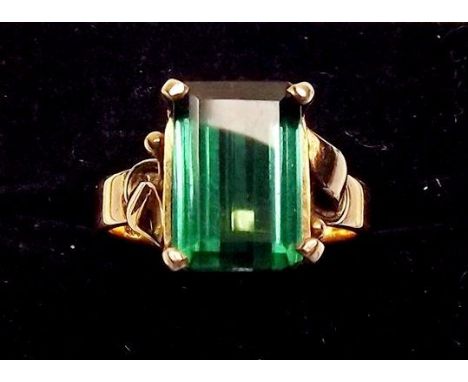 A 14 carat gold ring set step cut green/blue stone possibly a green topaz