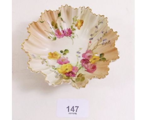 A Royal Worcester frilled bowl painted flowers on an ivory blush ground, date code 1902