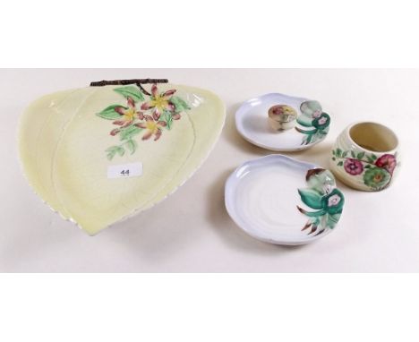 A Carlton Ware yellow leaf dish, three pieces of Clarice Cliff and a Royal Worcester pill box painted flowers on an ivory blu