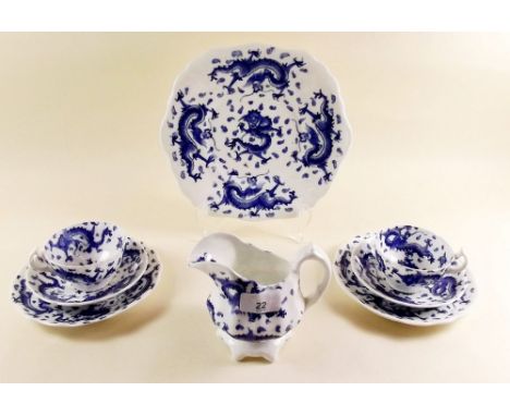 An Asbury 'Dragon' blue and white tea service comprising: twelve cups and saucers, twelve tea plates, two cake plates, sugar 