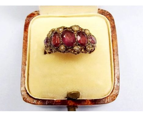 A Victorian 9ct gold ring set rubies and seed pearls 