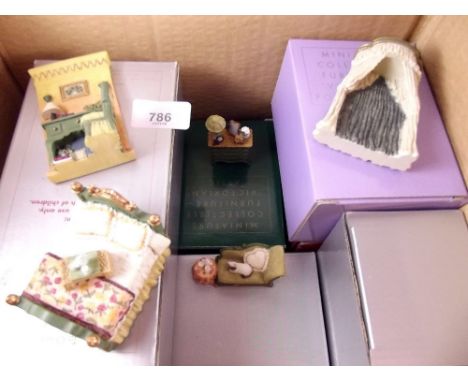 A collection of vintage Avon dolls house furniture 