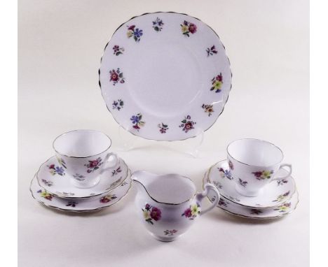 A Royal Vale floral tea service comprising: cake plate, seven cups, six saucers, six tea plates and milk 