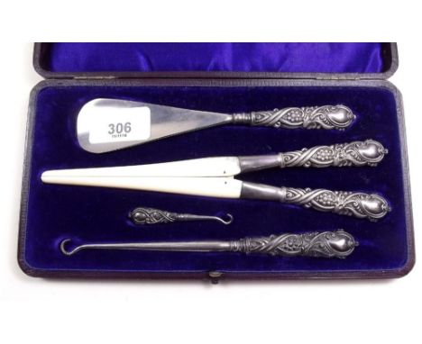 A Victorian silver and ivory shoe horn, two button hooks and glove stretchers, Birmingham 1898 and a George V commemorative c