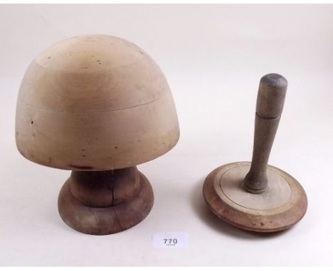 A wooden milliners hat stand 'West End Shopfitters' and a darning mushroom