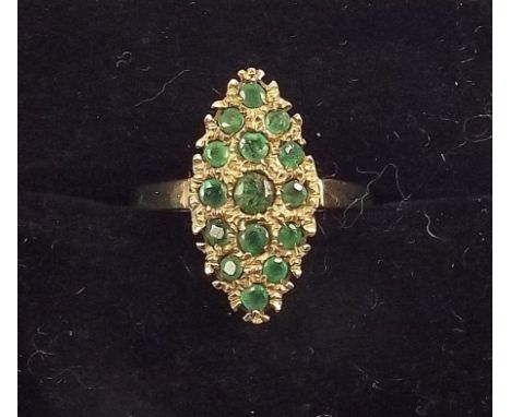 A 9ct gold marquise form ring set emeralds 