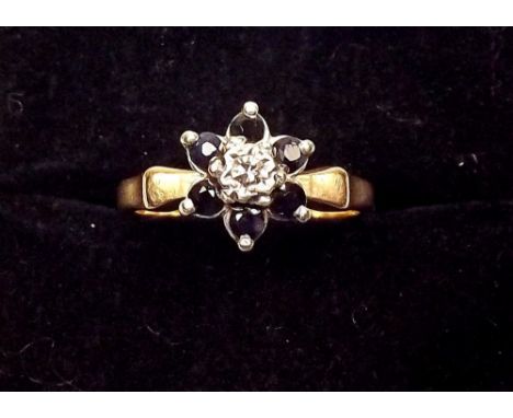 A 9ct gold sapphire and diamond cluster ring 