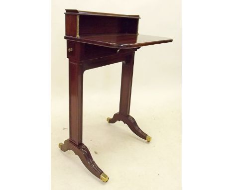 An early 20th century mahogany ladies folding writing cabinet, the drop flap writing surface with shelf to back, two drawers 