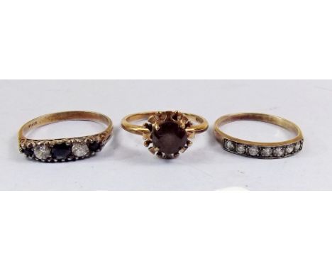 A 9ct gold ring set brown stone and two silver rings 