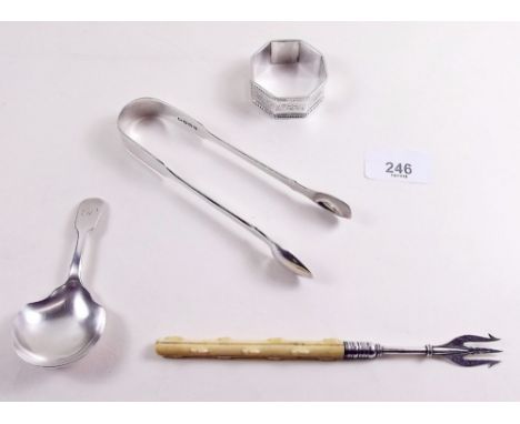 A silver and ivory pickle fork, Birmingham 1893, silver napkin ring, Birmingham 1906, silver caddy spoon London 1847 and pair