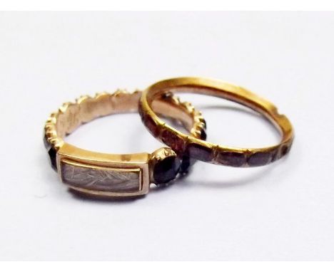 A Victorian mourning ring dated 1834 set jet and hair panel and another ring