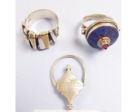 Two silver rings and a Hebrew white metal ring 