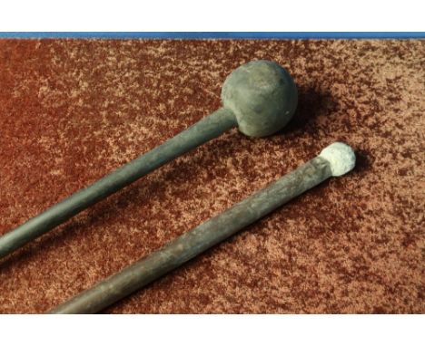 African Zulu type Knobkerrie club with bulbous end (overall length 70cm) and another staff with lead weighted end (2) 