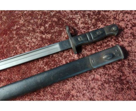 Remington 1913 bayonet with 17 inch blade marked 1913 3 17Remington, with broad arrow mark CCA, two piece wooden grip and lea