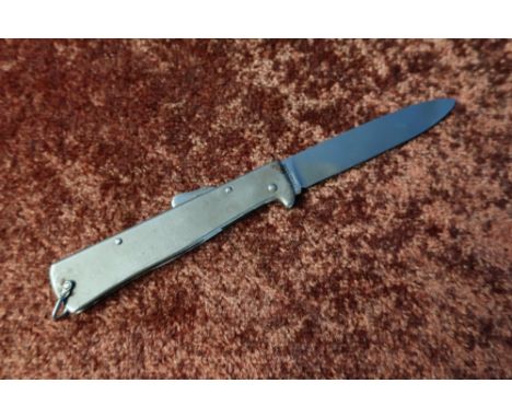 Stainless steel pocket knife with lanyard ring, 3 1/4 inch blade marked Rostfrei 