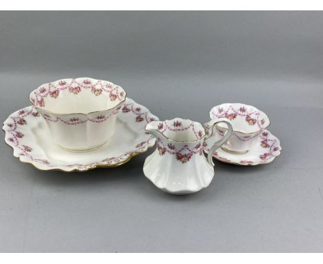 PARAGON TEA SERVICE, transfer-decorated with floral swags, comprising 12 cups, 12 saucers, 11 side plates, 2 cake plates, sug