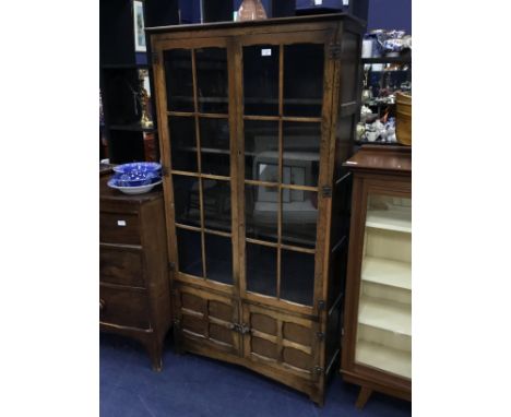 EARLY 20TH CENTURY OAK TWO DOOR BOOKCASE, with glazed doors over two panelled doors, 90cm wide