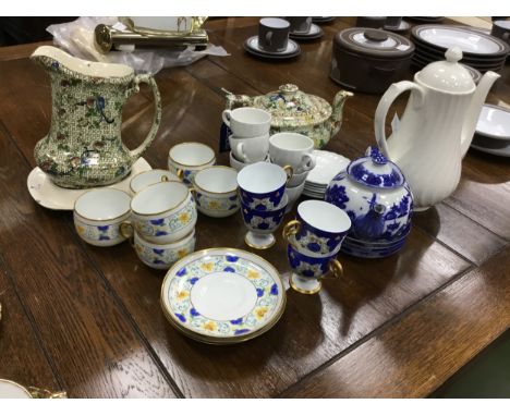 LIMOGES BLUE AND GILT PART COFFEE SERVICE, along with another part coffee service, with floral and gilt decoration, and tea w