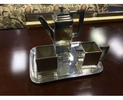 MODERNIST PLATED THREE PIECE TEA SERVICE, on tray, the tea pot 21.5cm high