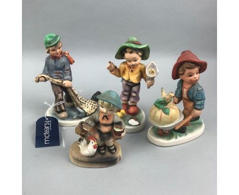 GERMAN FRIEDEL FIGURE OF A BOY WITH FISH, 15cm high, along with a gurgle jug, various other ceramic figures, carved wood figu