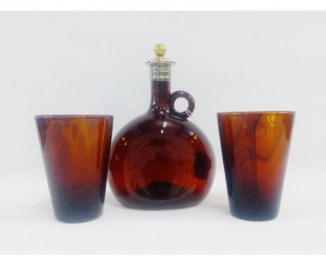 Coloured glass gin flask with silver plated mounts and stopper, together with two amber coloured glass beakers, tallest 21cm,