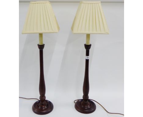 Pair of wooden table lamp bases with pleated shades, 73cm high overall, (2) 