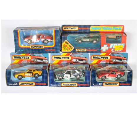 Matchbox Superkings, a mixed boxed group of Racing Cars to include, (1) K84 Peugeot 305 (2) K98 Porsche 944 (3) K157 Porsche 