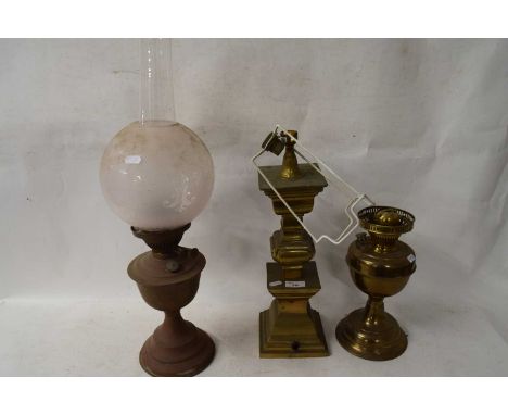 TWO OIL LAMPS AND A FURTHER BRASS TABLE LAMP BASE