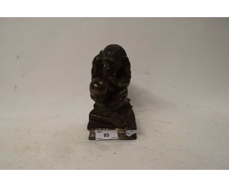 NOVELTY TABLE LIGHTER OR INKWELL STAND FORMED AS A MONKEY HOLDING A SKULL (A/F)